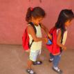 A couple of the many backpacks provided to children!